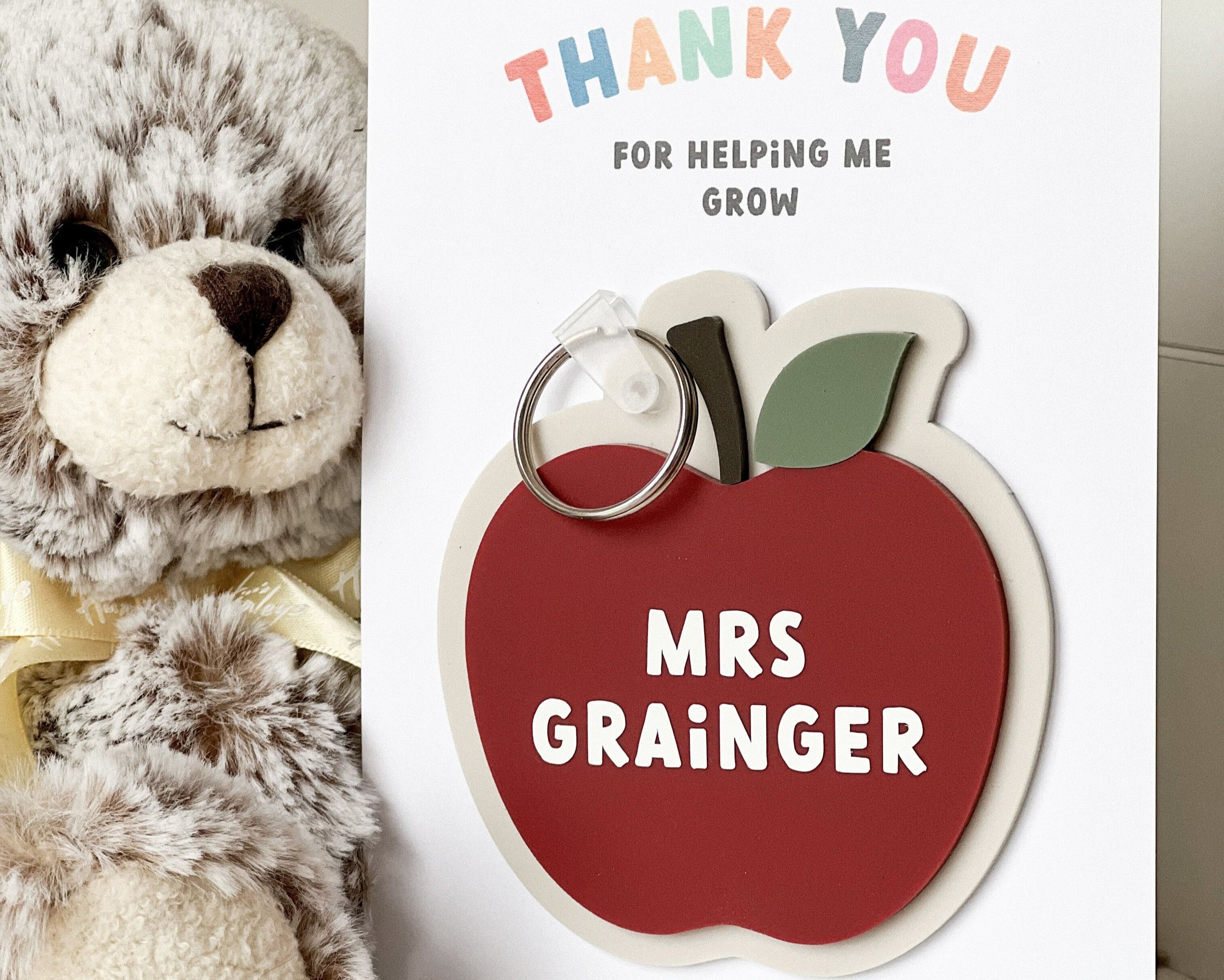 Personalised Thank you teacher keyring in the shape of an apple with teachers names on front
