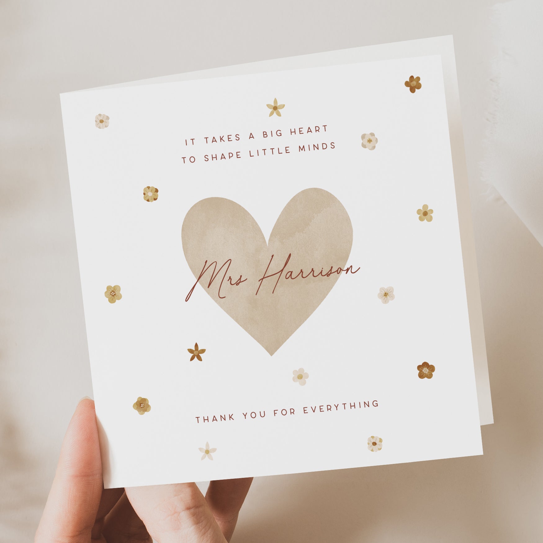 Personalised teacher thank you card featuring a large beige heart, floral details, and the name “Mrs Harrison.” Text reads “Thank you for everything.”
