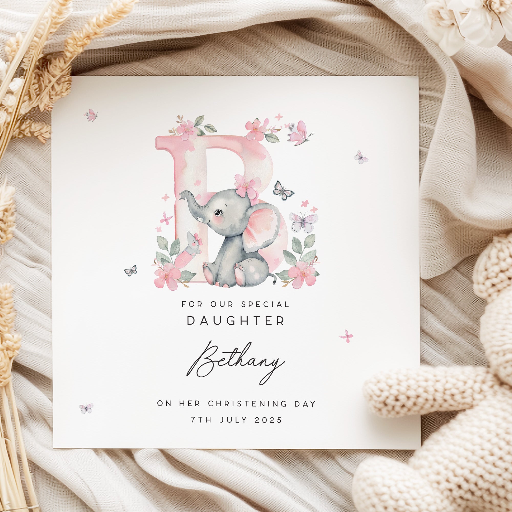 Personalised daughter christening card with cute elephant illustration, pink floral design, and custom name and date