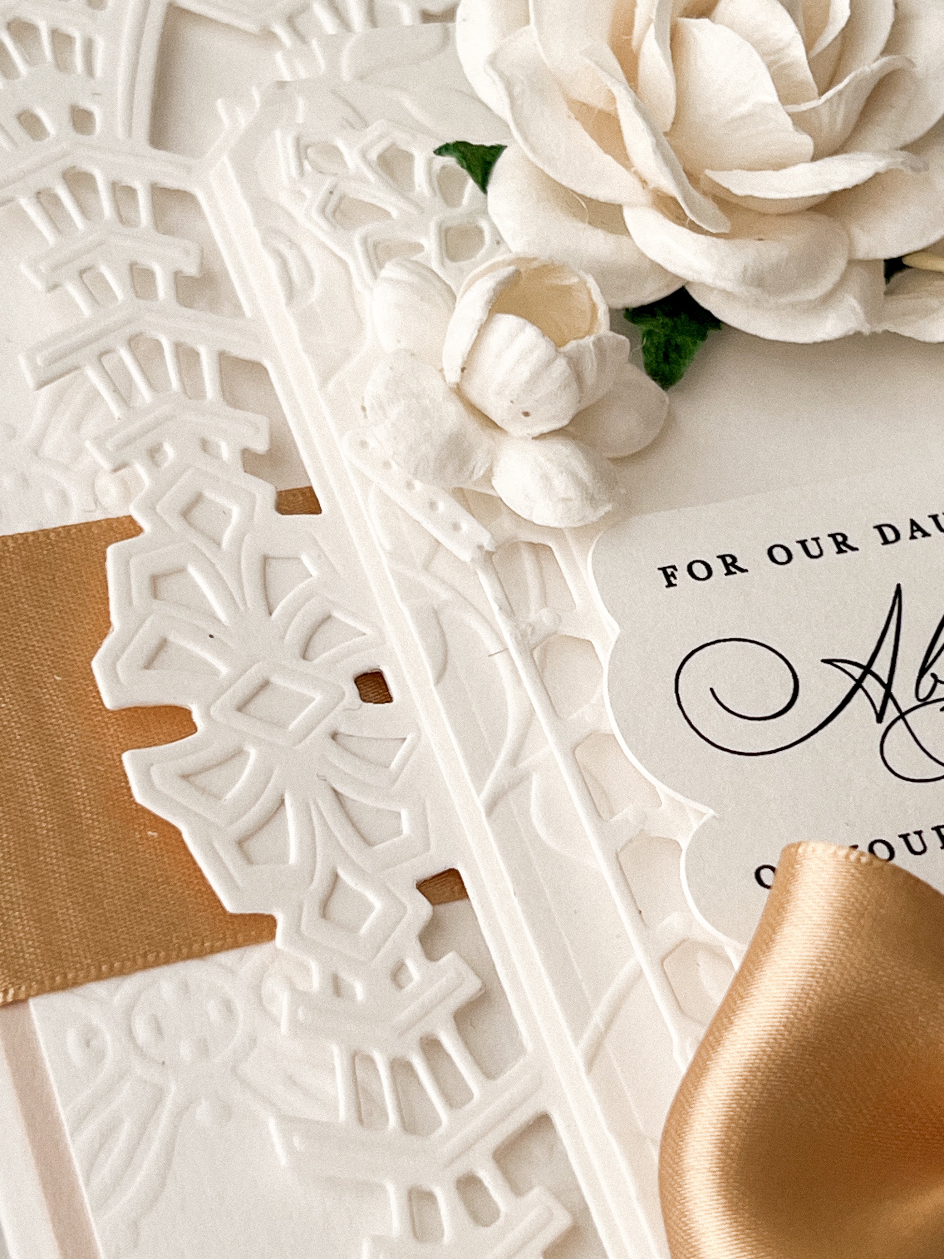 Close up of embossing and debossing on Luxury wedding card