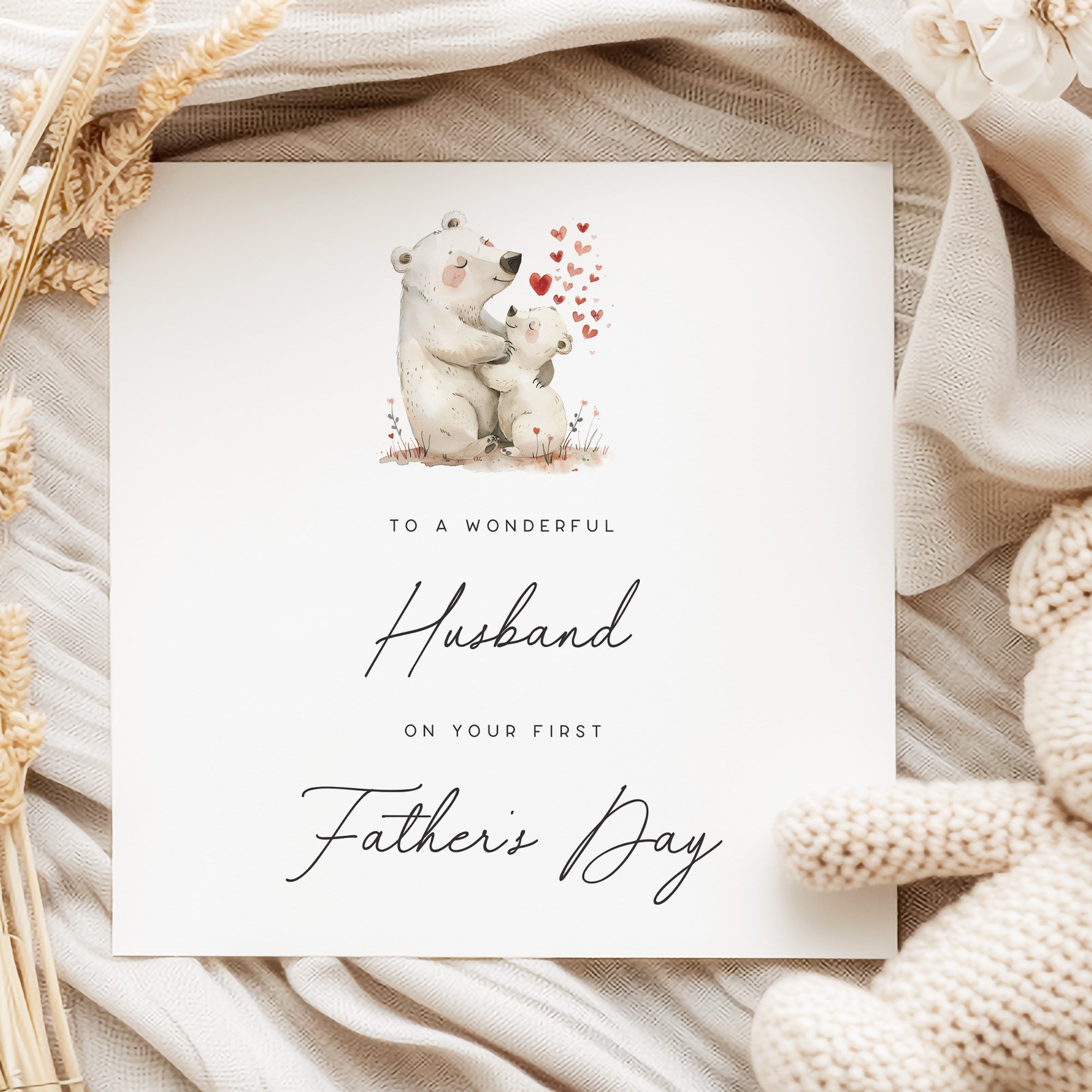 To my Husband on your 1st Father's Day featuring a daddy and baby polar bear with red hearts.